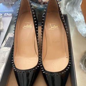 Christian Louboutin black with spikes red bottoms